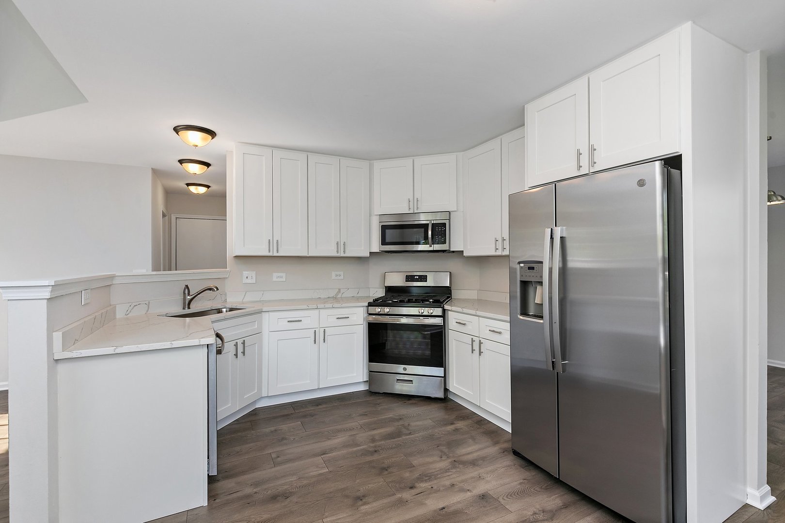 240 Penny Lane Bolingbrook, IL 60440 - Photo 7 of 22 a kitchen with a sink cabinets and stainless steel appliances
