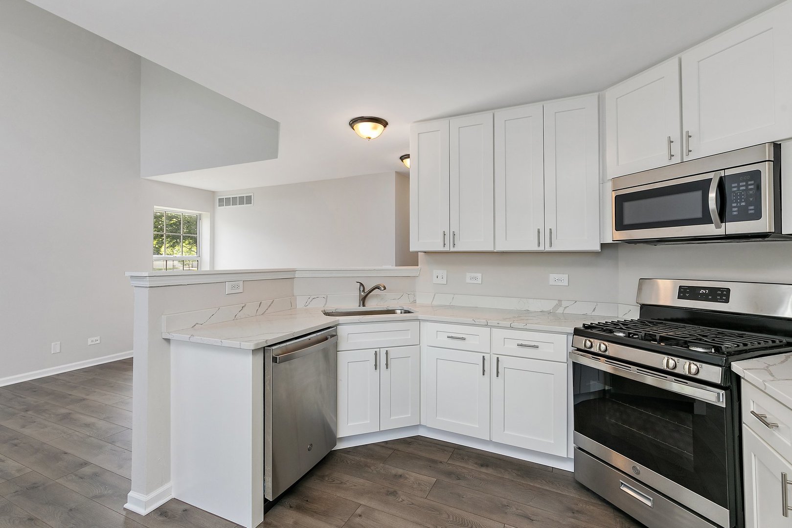 240 Penny Lane Bolingbrook, IL 60440 - Photo 8 of 22 a kitchen with cabinets stainless steel appliances and a sink