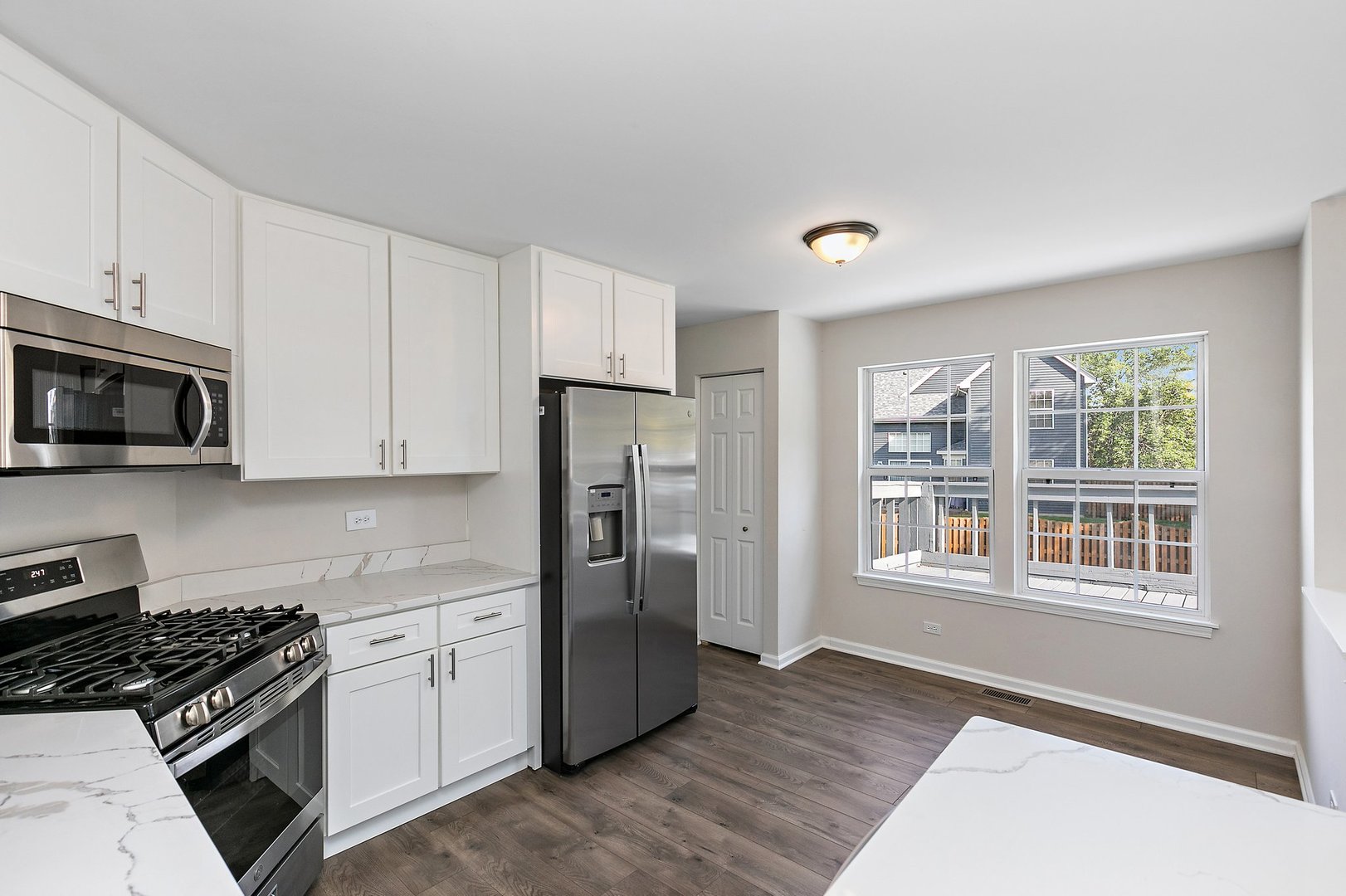 240 Penny Lane Bolingbrook, IL 60440 - Photo 9 of 22 a kitchen with stainless steel appliances a refrigerator stove and microwave