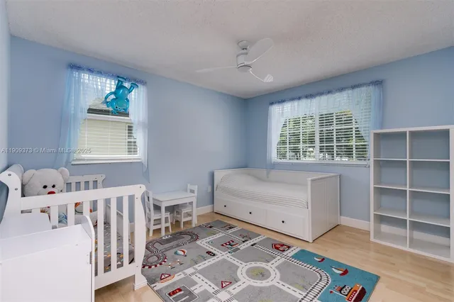 a bedroom with furniture and a window