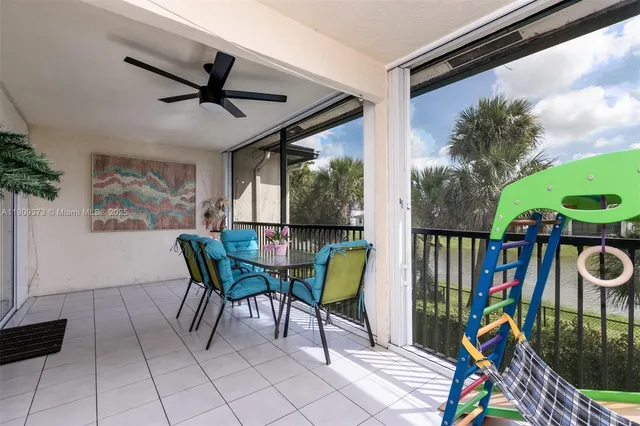 a view of a dining room with furniture window and outside view