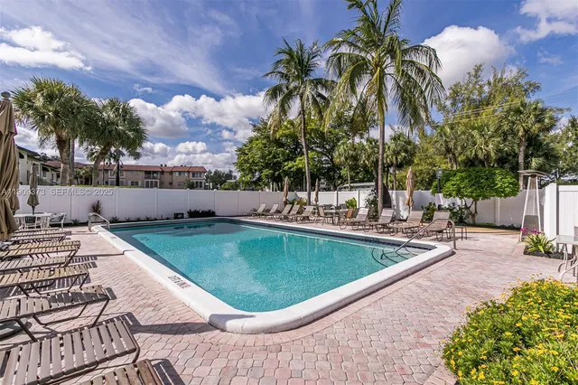 a view of a swimming pool with a patio
