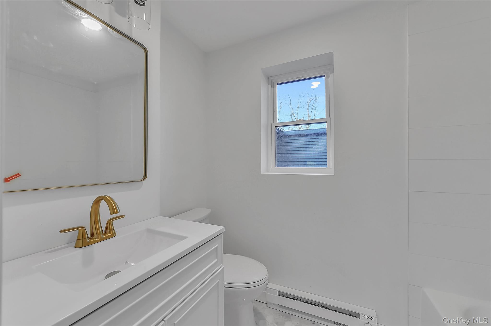67 Jacobs Road Westtown, NY 10998 - Photo 24 of 36 Bathroom with vanity, a baseboard radiator, and a tub