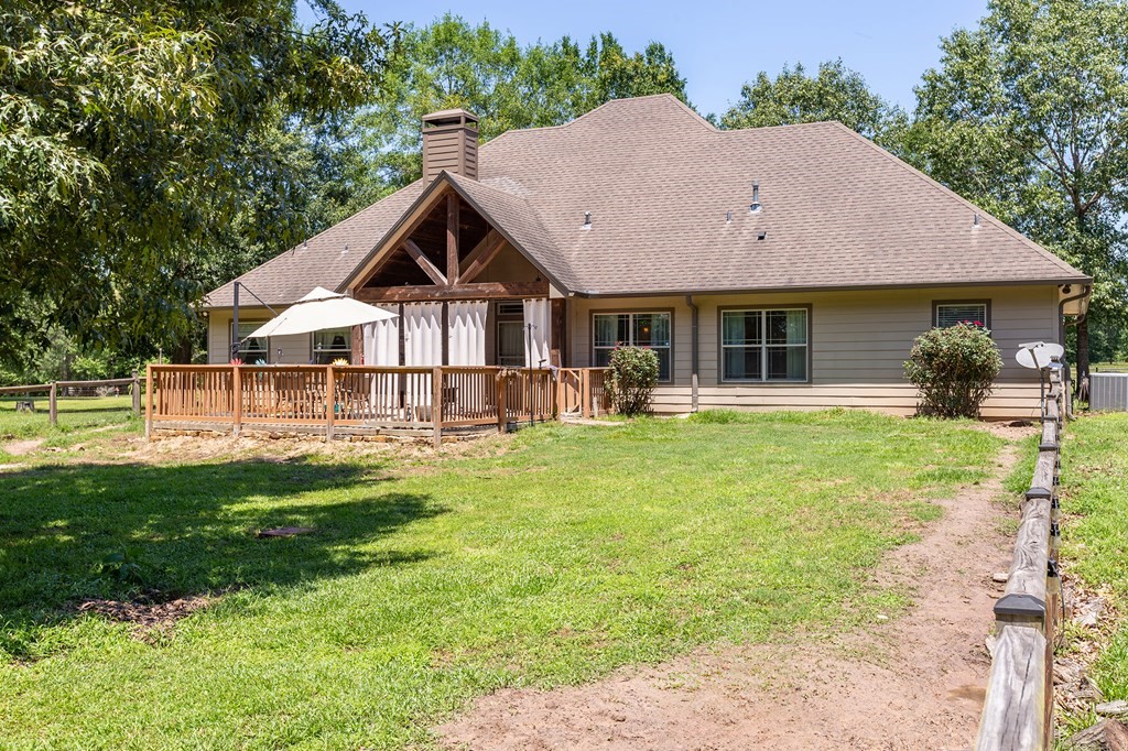 1171 Old Ewing Road Lufkin, TX 75901 - Photo 30 of 49 a view of house with garden and tall trees