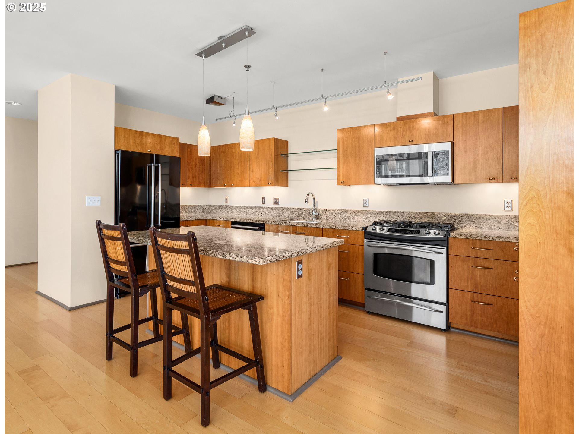 1221 Southwest 10th Avenue, Unit 505 Portland, OR 97205 - Photo 17 of 41 a kitchen with stainless steel appliances a stove a sink dishwasher and a refrigerator
