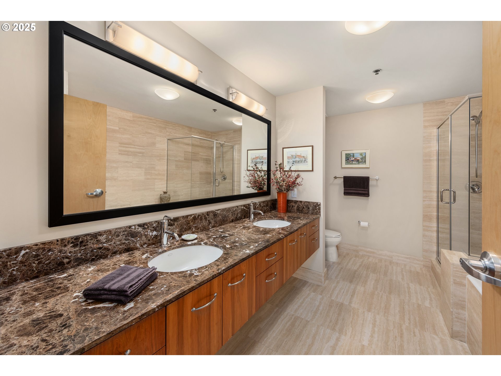 1221 Southwest 10th Avenue, Unit 505 Portland, OR 97205 - Photo 23 of 41 a bathroom with a granite countertop sink mirror and double