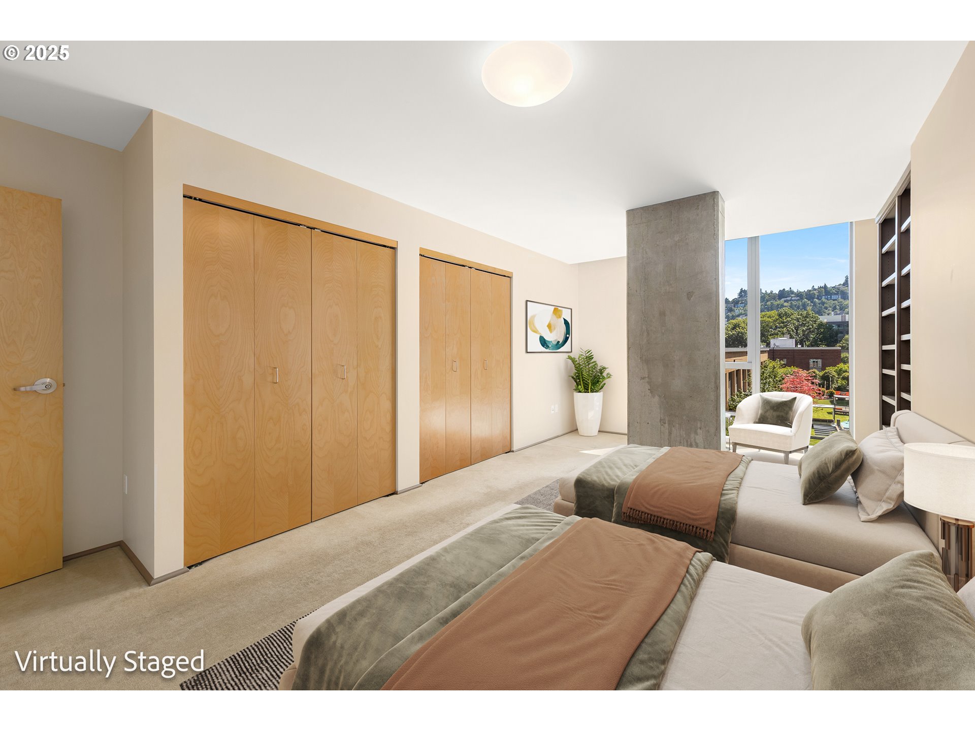 1221 Southwest 10th Avenue, Unit 505 Portland, OR 97205 - Photo 26 of 41 a bedroom with a large bed and a large window