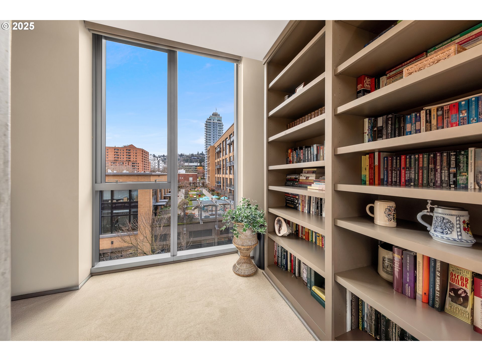 1221 Southwest 10th Avenue, Unit 505 Portland, OR 97205 - Photo 27 of 41 a room with lots of books