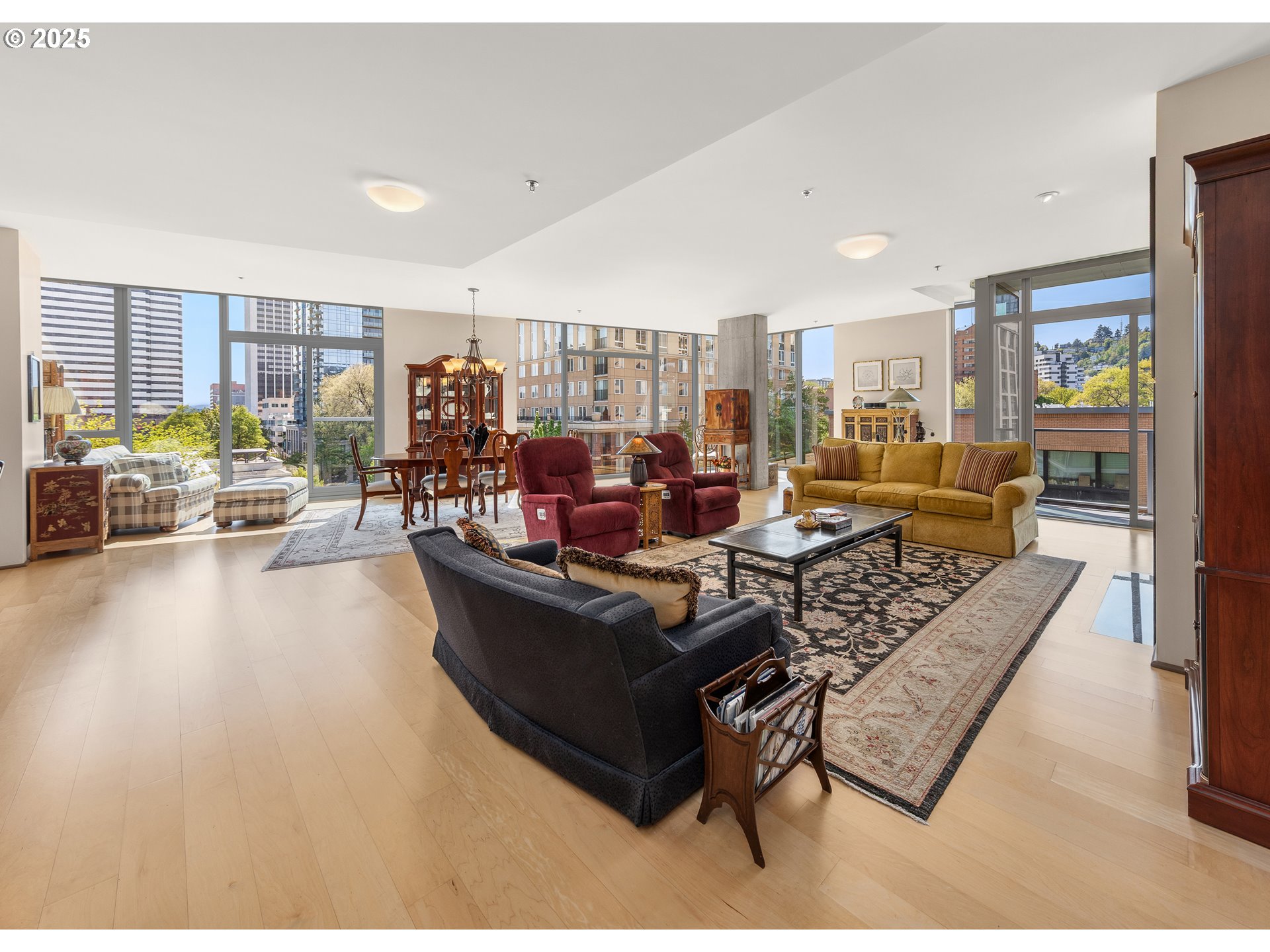 1221 Southwest 10th Avenue, Unit 505 Portland, OR 97205 - Photo 3 of 41 a living room with furniture and a large window