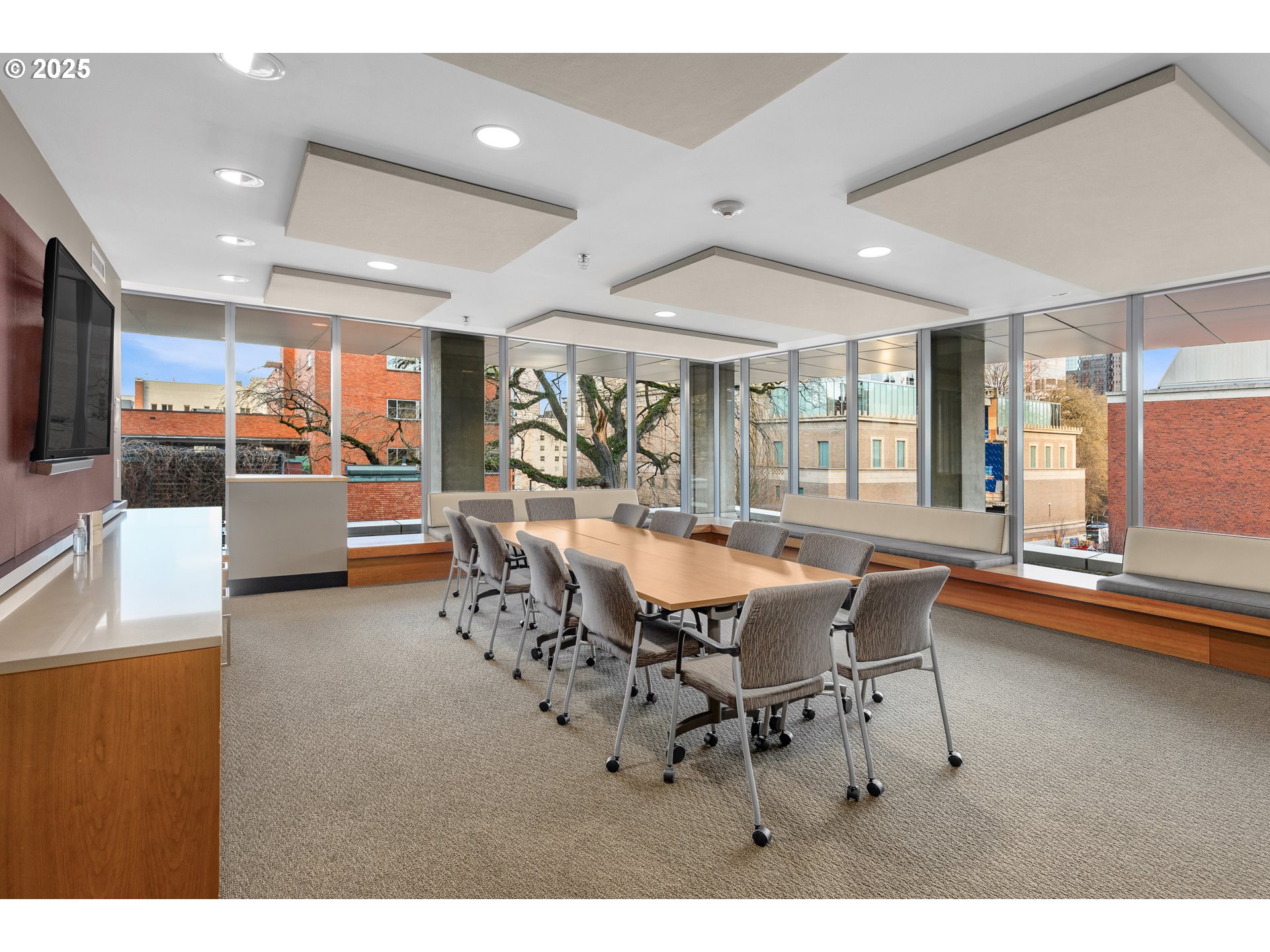 1221 Southwest 10th Avenue, Unit 505 Portland, OR 97205 - Photo 34 of 41 a dining hall with stainless steel appliances kitchen island granite countertop a table and chairs