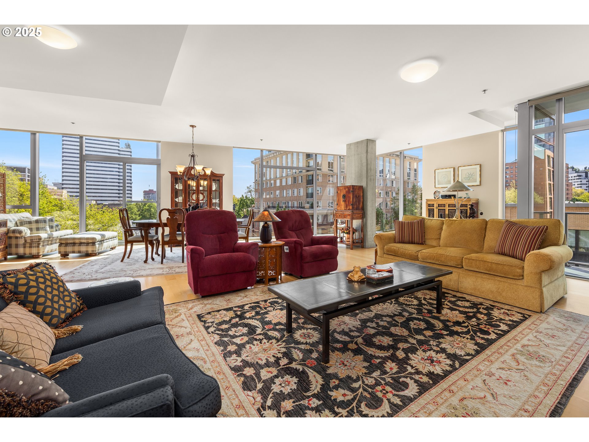 1221 Southwest 10th Avenue, Unit 505 Portland, OR 97205 - Photo 5 of 41 a living room with furniture and a large window