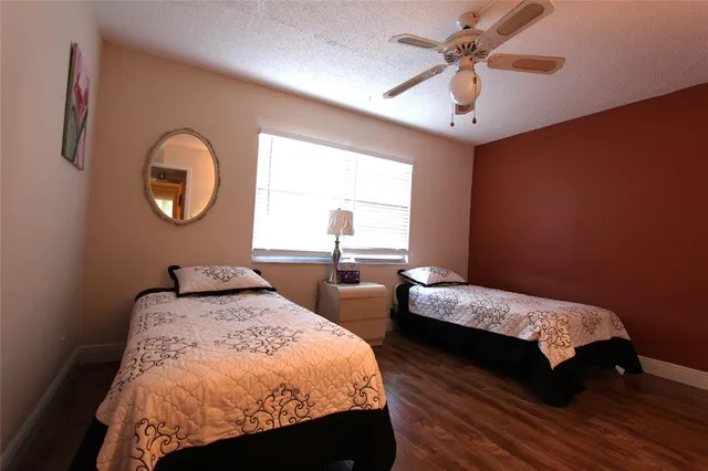 a bedroom with bed and a window