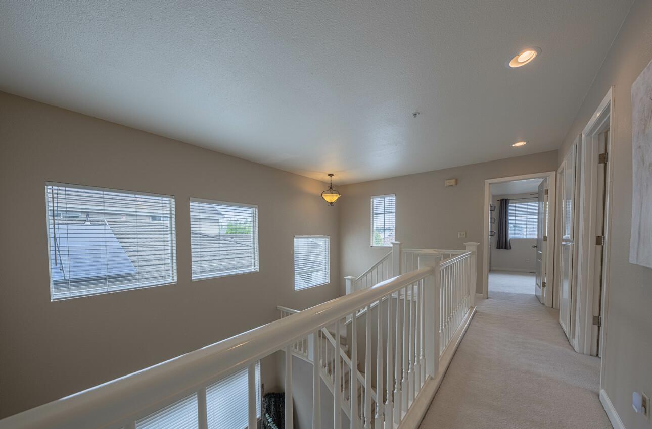 18106 Stonehaven Salinas, CA 93908 - Photo 26 of 39 a view of livingroom with stairs and windows