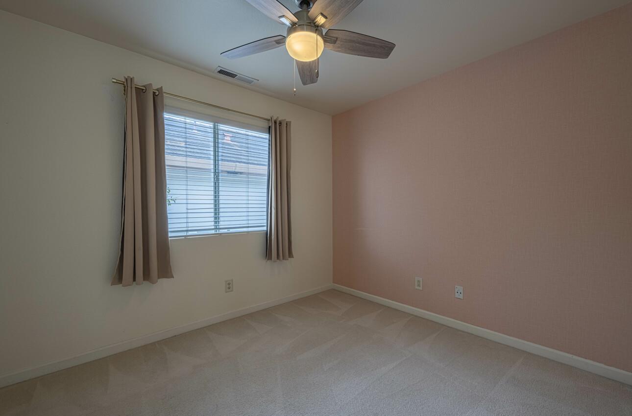 18106 Stonehaven Salinas, CA 93908 - Photo 35 of 39 an empty room with windows and a ceiling fan