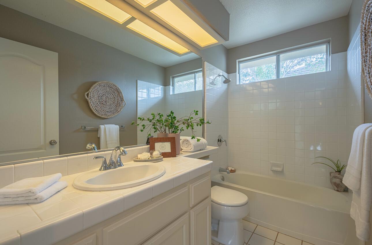 18106 Stonehaven Salinas, CA 93908 - Photo 39 of 39 a bathroom with a granite countertop sink toilet and shower