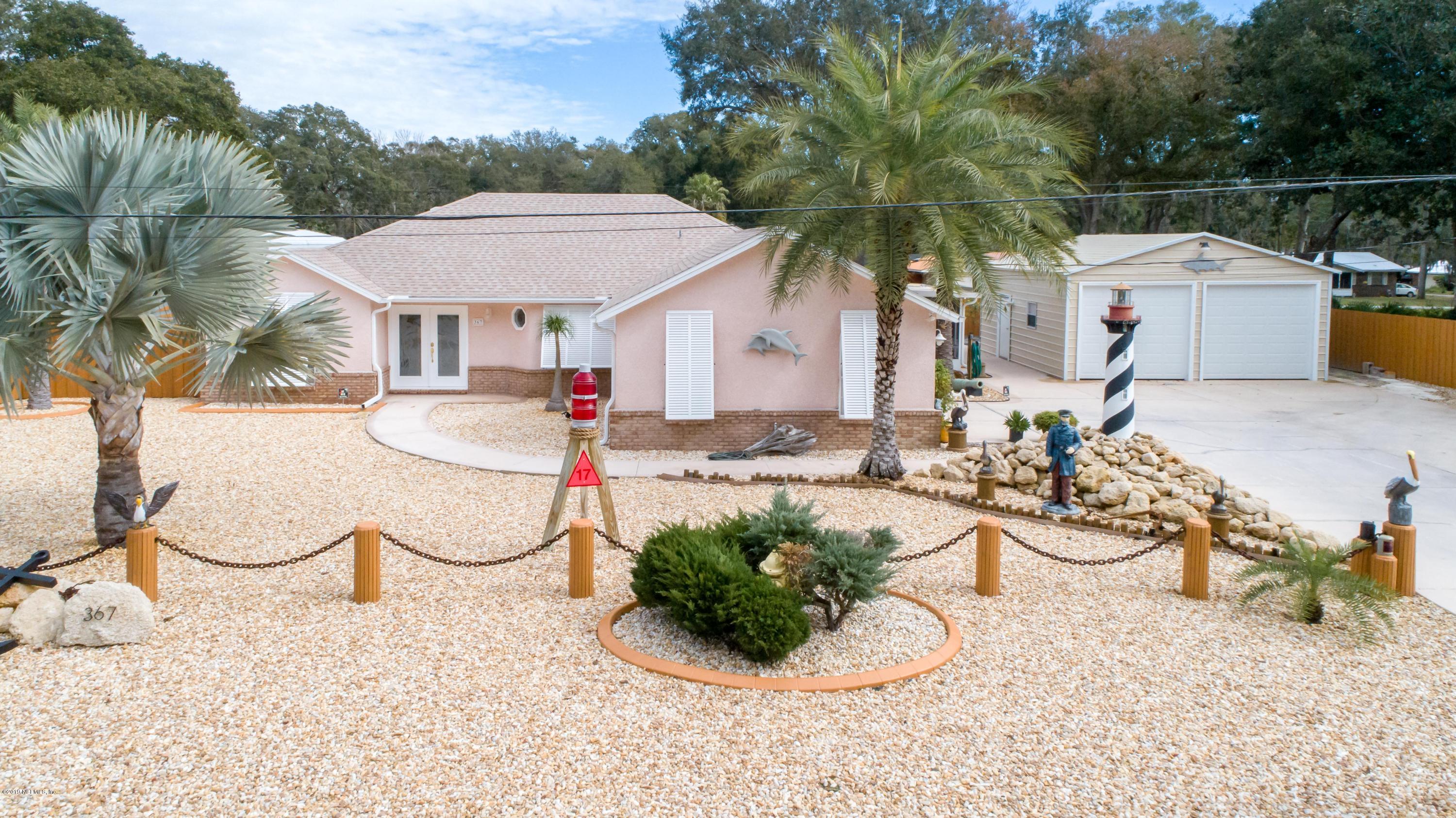 367 Shamrock Road St. Augustine, FL 32086 - Photo 1 of 58 a view of a house with backyard and sitting area