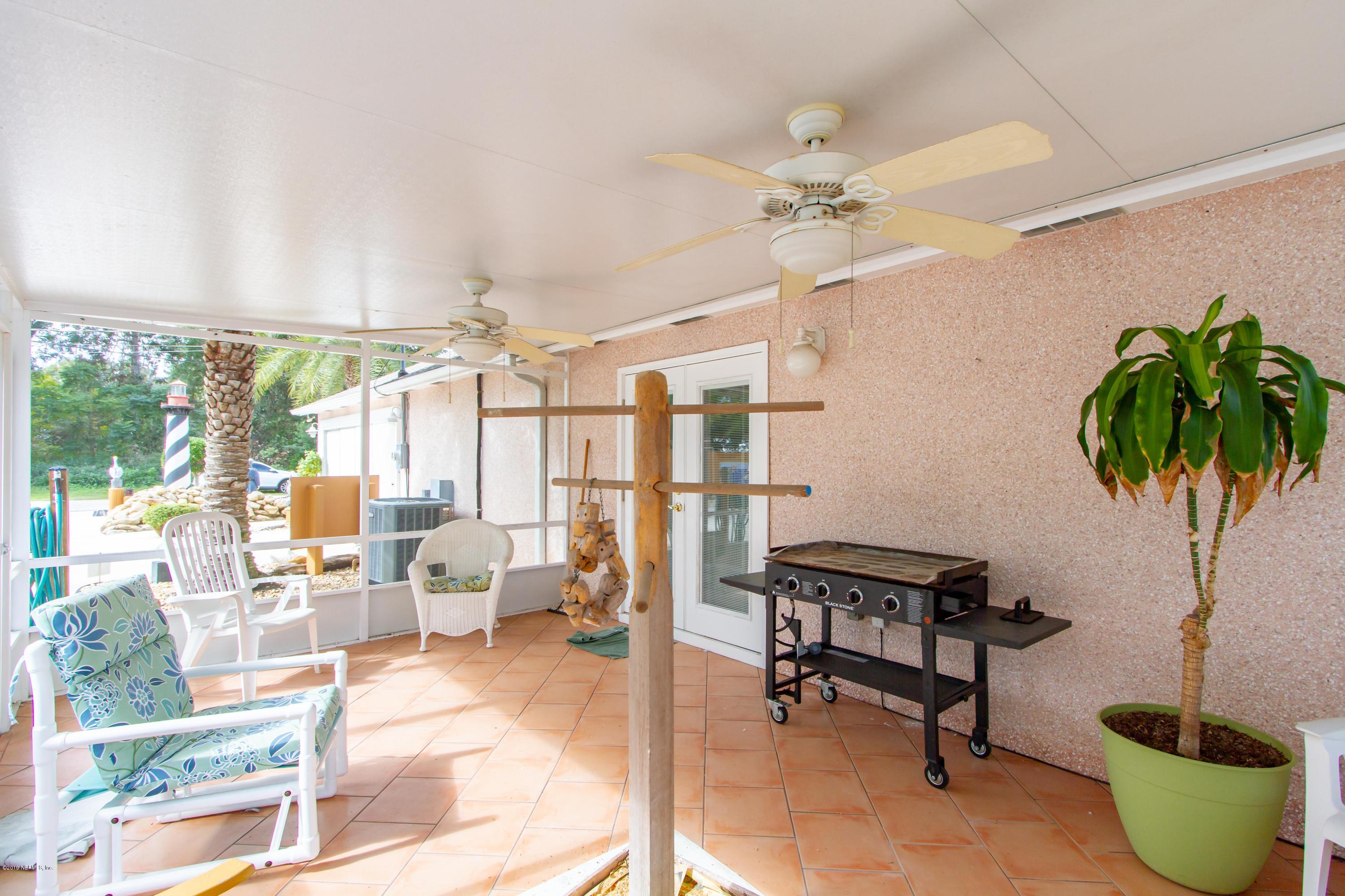 367 Shamrock Road St. Augustine, FL 32086 - Photo 34 of 58 a living room with furniture and a potted plant