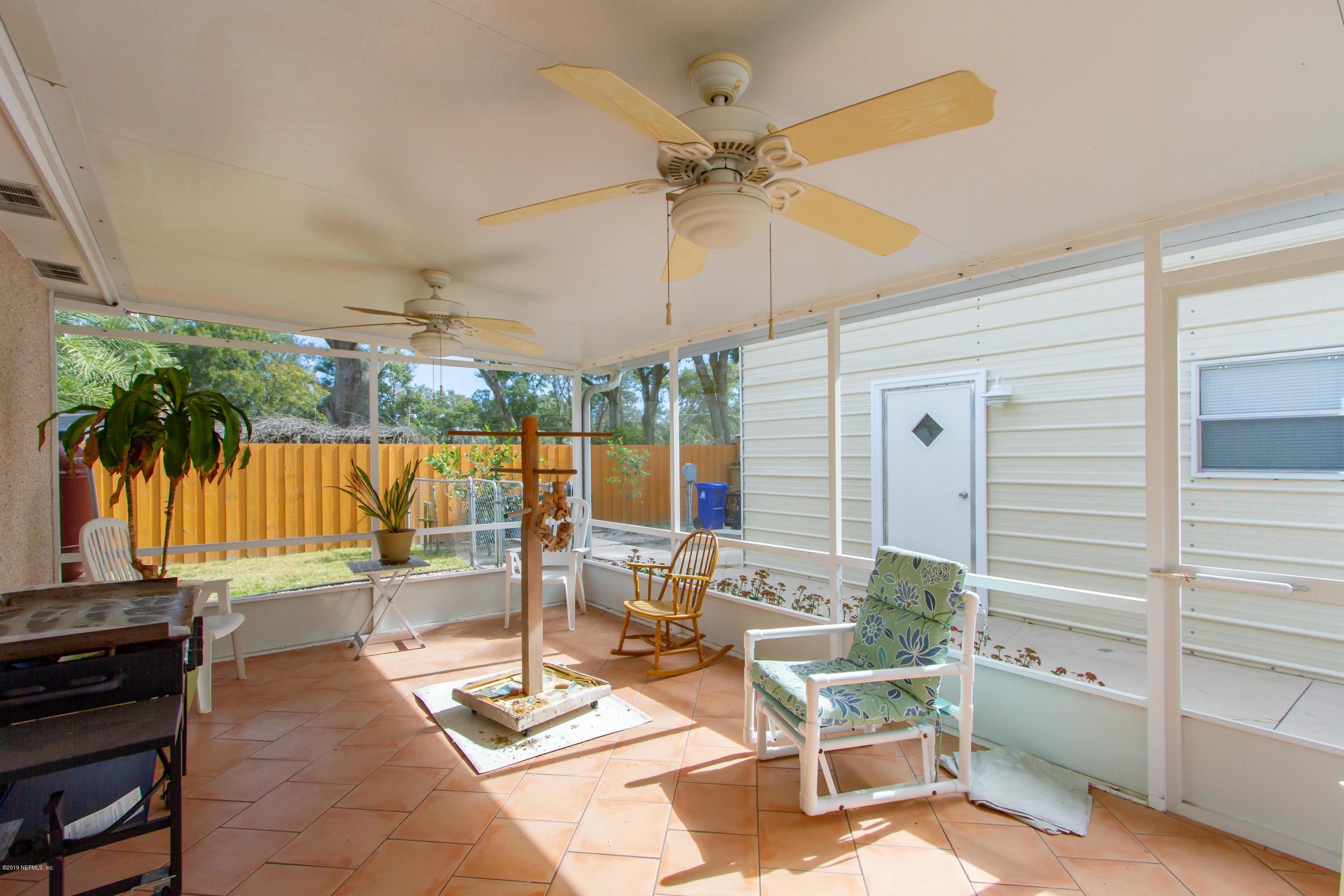 367 Shamrock Road St. Augustine, FL 32086 - Photo 35 of 58 a view of a patio with a table and chairs