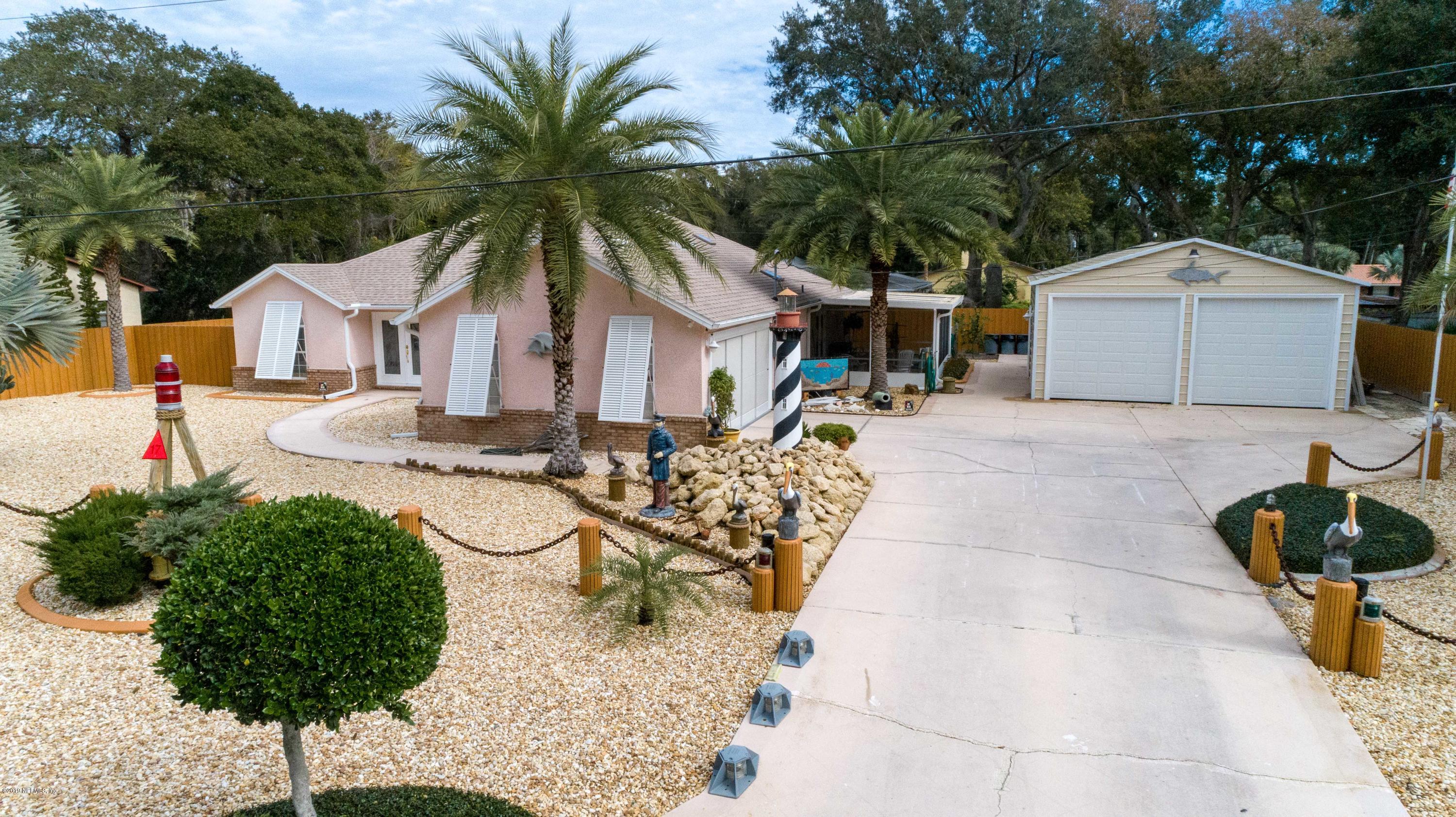 367 Shamrock Road St. Augustine, FL 32086 - Photo 47 of 58 a front view of a house with garden