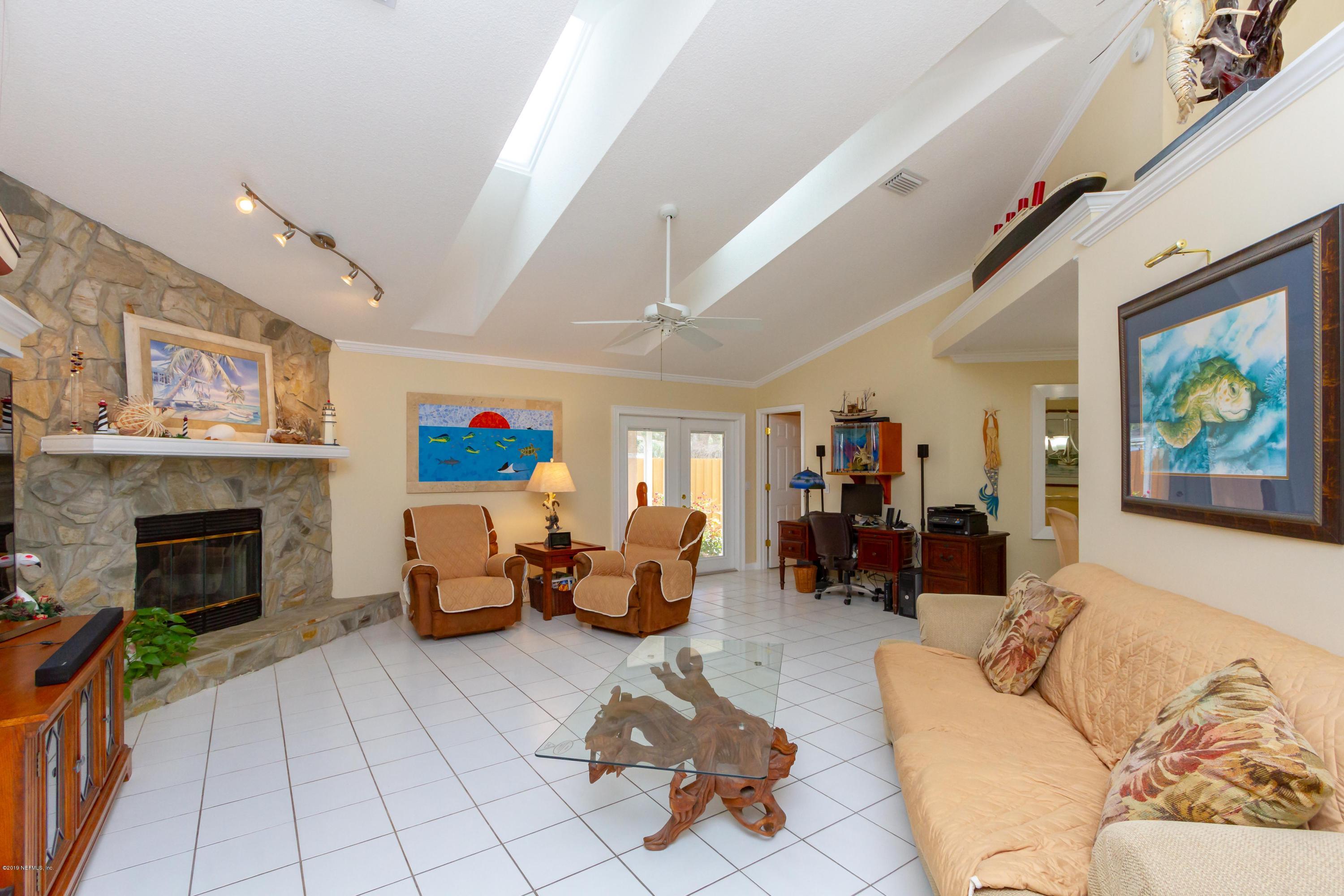 367 Shamrock Road St. Augustine, FL 32086 - Photo 9 of 58 a living room with furniture or couch and a fireplace