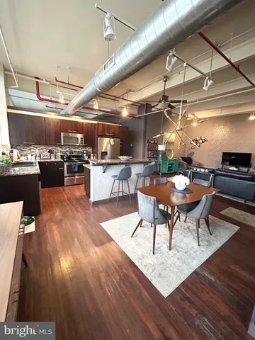 a kitchen with a table and chairs in it