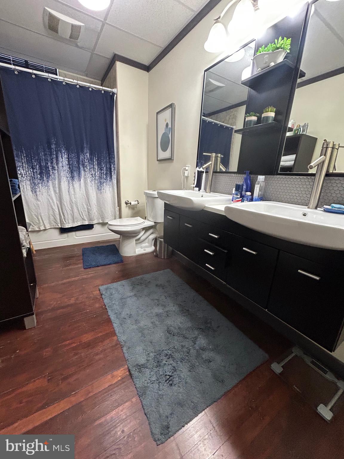 31 South Sterley Street, Unit 401 Reading, PA 19607 - Photo 7 of 12 a bathroom with a sink and a mirror
