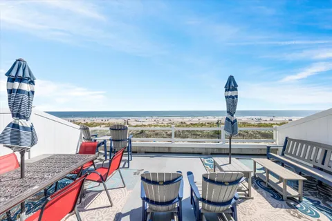a view of city from balcony with seating space