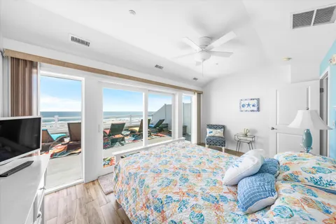 a bathroom with a granite countertop sink a toilet and a mirror