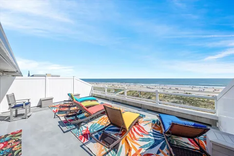 a bedroom with a bed a window and a flat screen television
