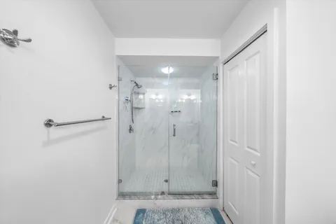 a bedroom with two beds and a flat screen tv