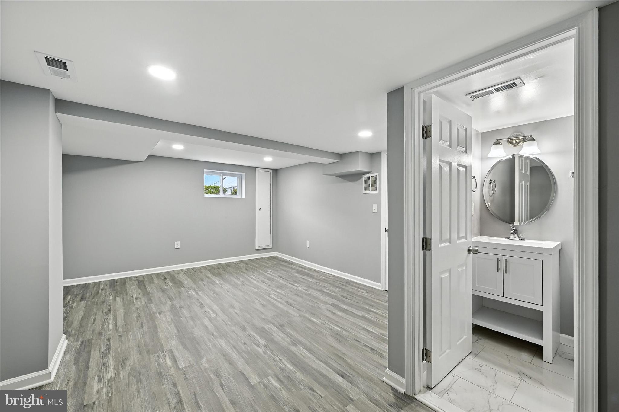 1118 Weldon Avenue Baltimore, MD 21211 - Photo 22 of 27 a view of hallway with granite countertop wooden floor