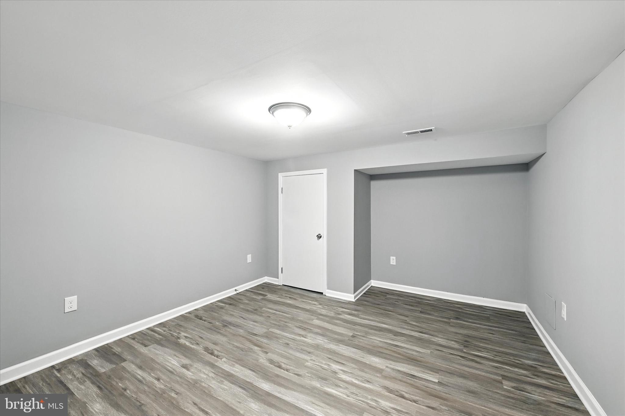1118 Weldon Avenue Baltimore, MD 21211 - Photo 24 of 27 a view of room with wooden floor