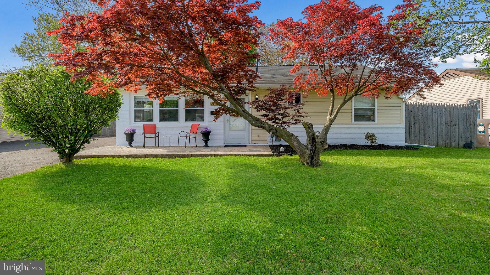 a view of house with backyard