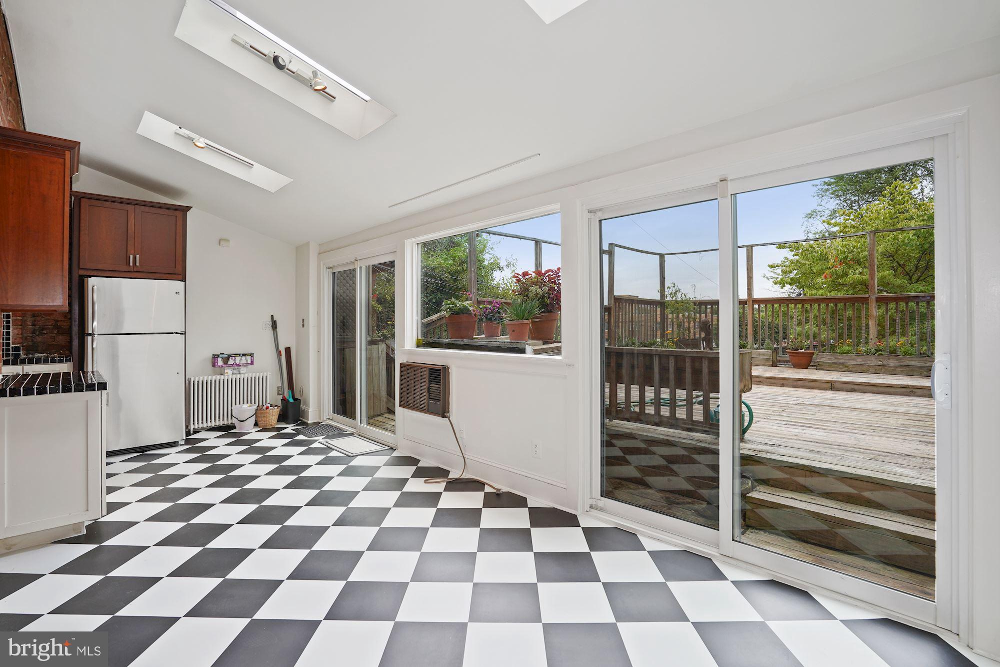 2805 Ontario Road Northwest Washington, DC 20009 - Photo 14 of 42 Large open Family room with sliding glass doors