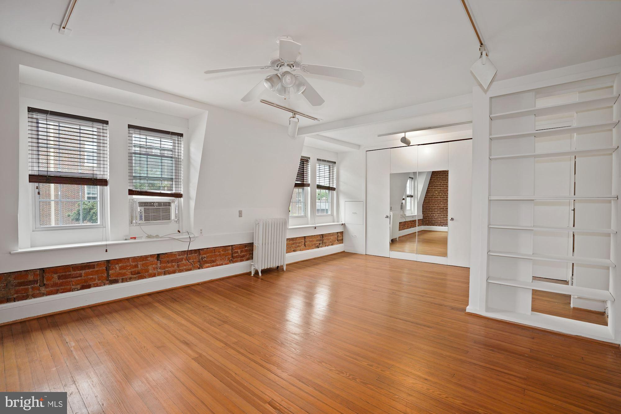 2805 Ontario Road Northwest Washington, DC 20009 - Photo 29 of 42 The master bedroom has built-ins and ceiling fan