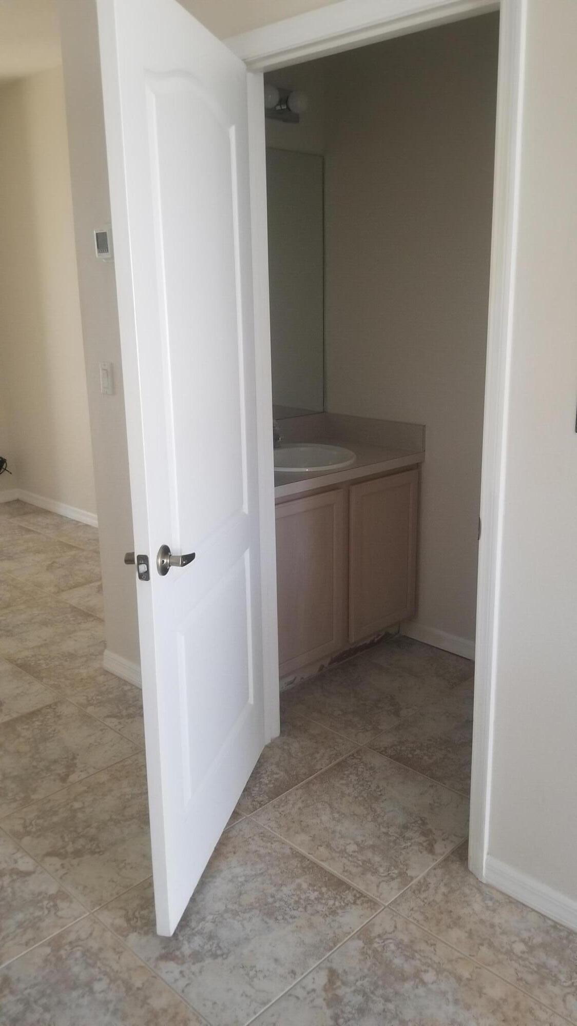 85 Pinafore Place Indialantic, FL 32903 - Photo 5 of 17 Downstairs Half Bathroom