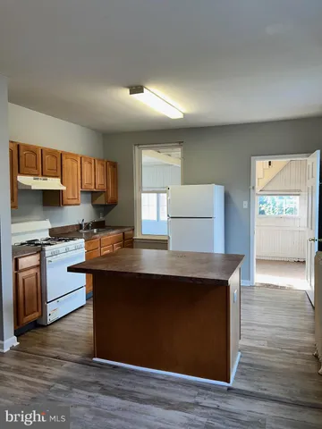 a view of kitchen and wooden floor