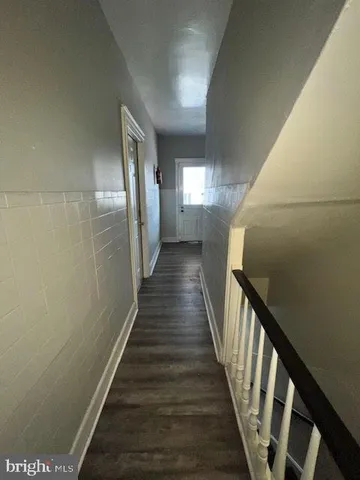 an empty room with a ceiling fan and a window