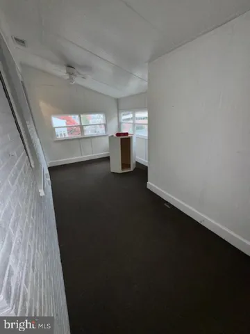 a view of a backyard with a tree