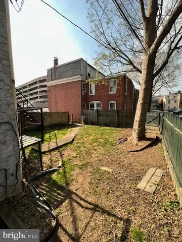 a front view of a residential apartment building with a yard