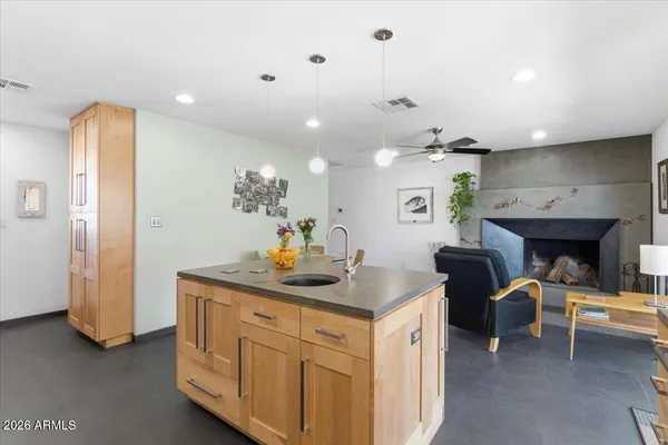 a kitchen with a sink stove and cabinets