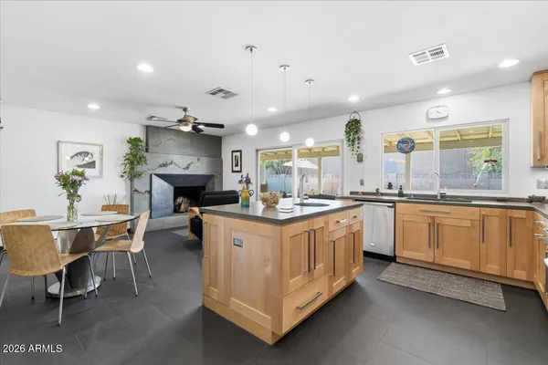 a kitchen with sink and cabinets