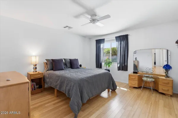 a large kitchen with stainless steel appliances granite countertop a lot of counter space and a sink
