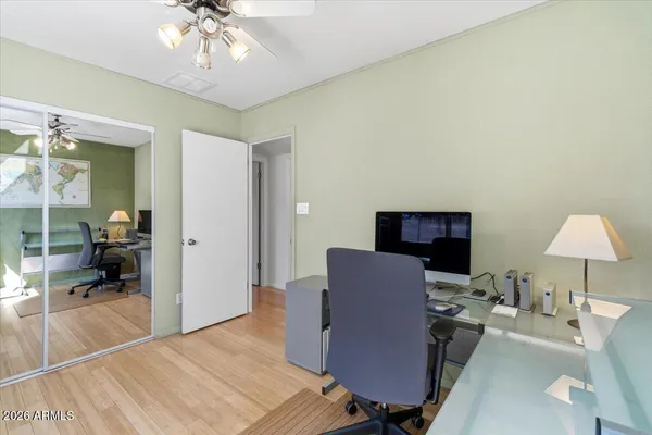 a work room with furniture and a window