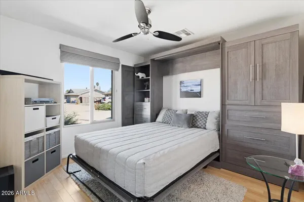 a bathroom with a toilet a sink and a mirror