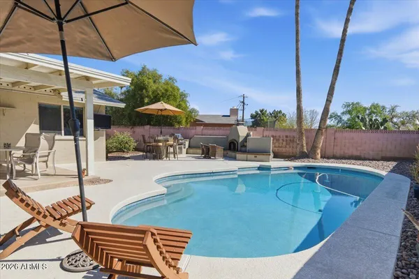 a view of a work place with furniture and table in the patio