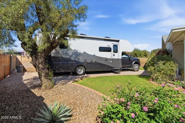 a view of a house with sitting area and garden