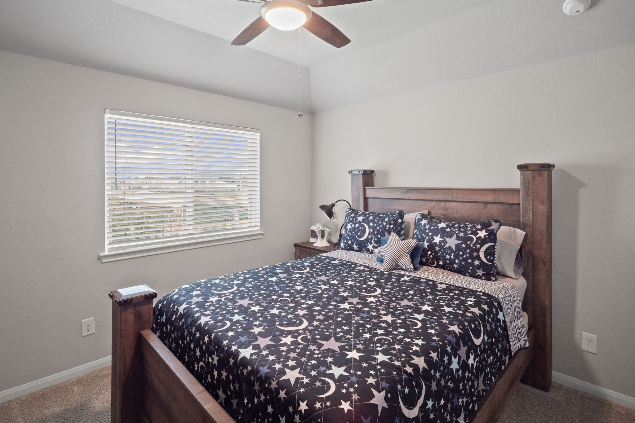 82 Indian Wells Drive Manvel, TX 77578 - Photo 13 of 30 a bed sitting in a bedroom next to a window