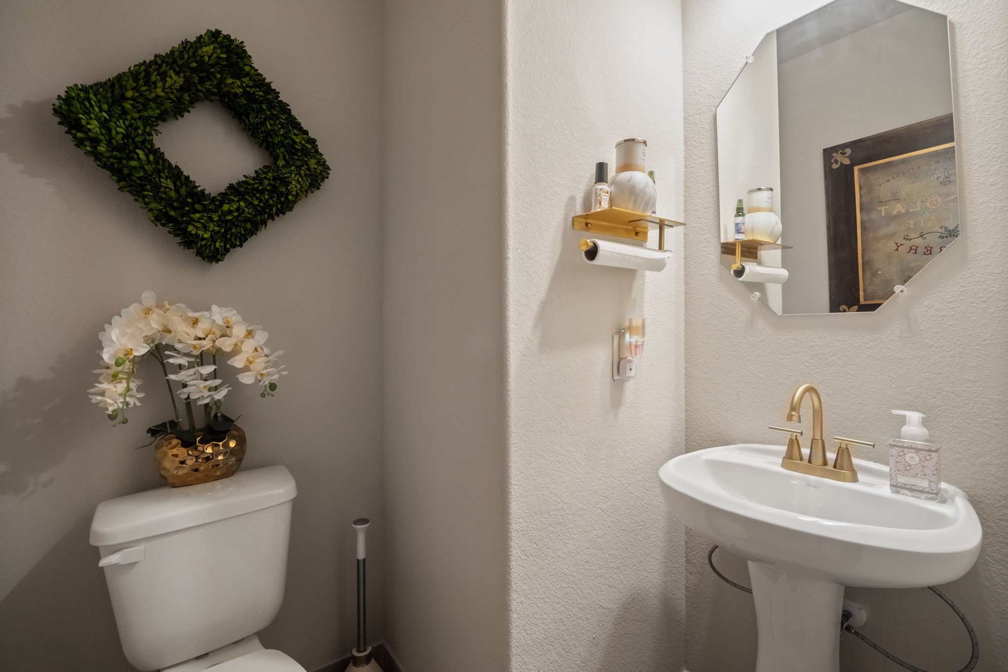 82 Indian Wells Drive Manvel, TX 77578 - Photo 18 of 30 a bathroom with a toilet sink and mirror