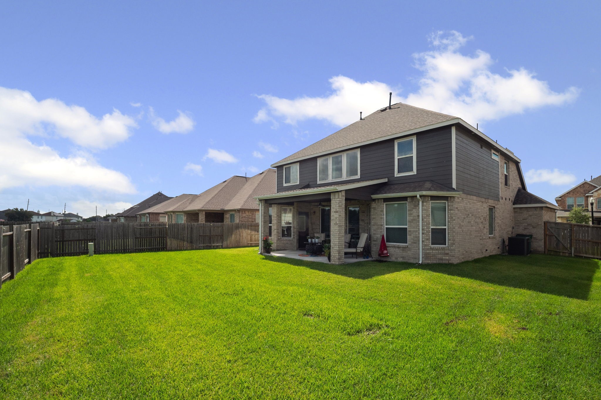 82 Indian Wells Drive Manvel, TX 77578 - Photo 24 of 30 a view of a house with a yard and sitting area